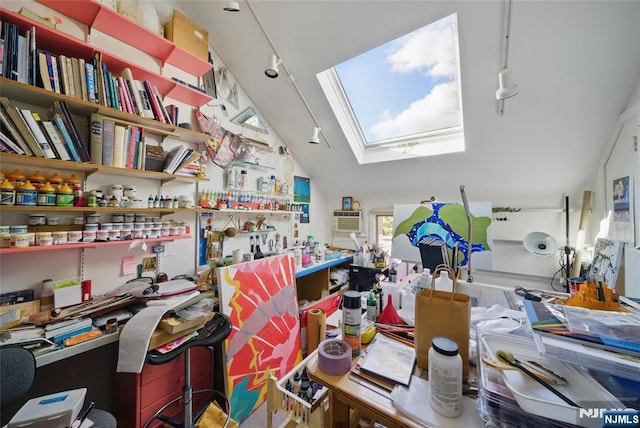 home office with lofted ceiling with skylight and a wall mounted AC