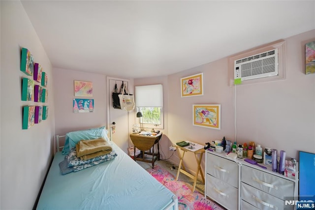 bedroom with a wall unit AC