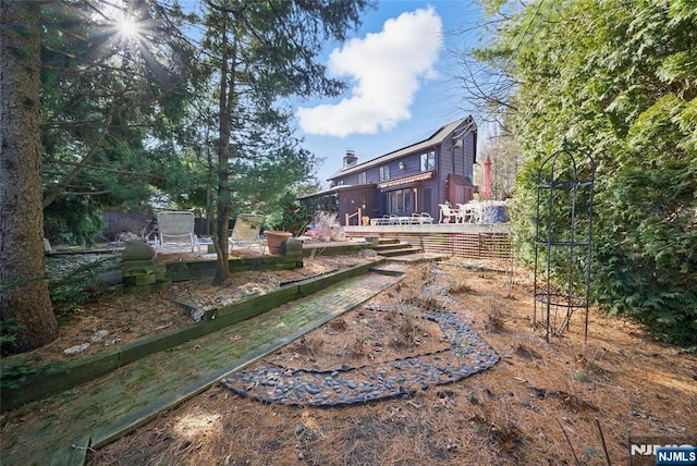 view of yard with a wooden deck