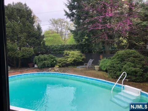 pool with a fenced backyard