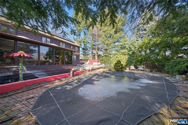 view of swimming pool with a patio area