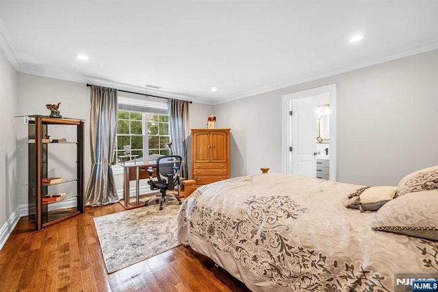 bedroom featuring crown molding, baseboards, wood finished floors, and recessed lighting