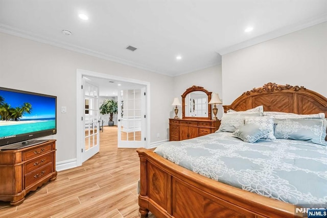 bedroom with french doors, light wood finished floors, recessed lighting, visible vents, and ornamental molding