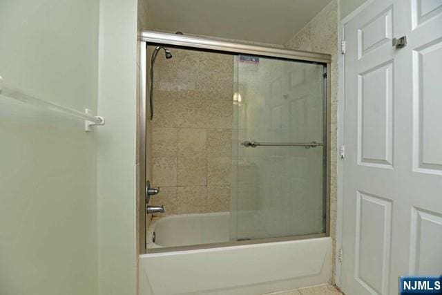 bathroom featuring enclosed tub / shower combo