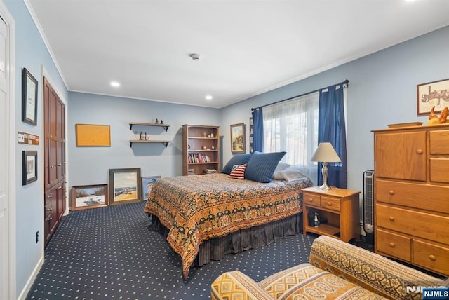 bedroom with crown molding, recessed lighting, and dark carpet