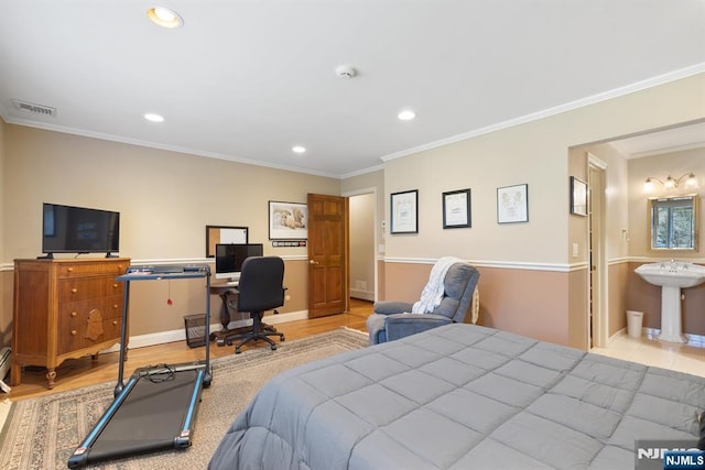 bedroom featuring visible vents, crown molding, baseboards, recessed lighting, and wood finished floors