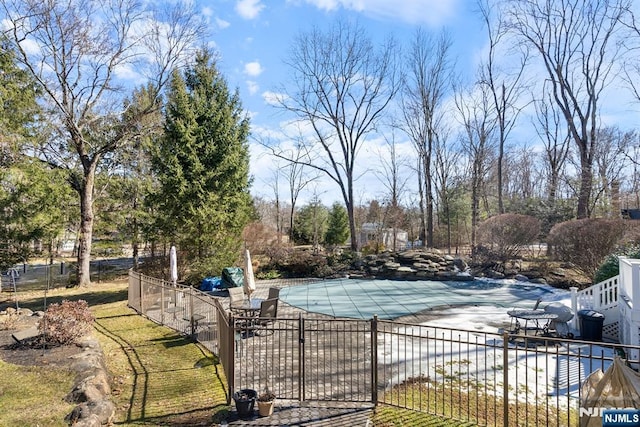 view of pool featuring a patio area, fence, and a fenced in pool