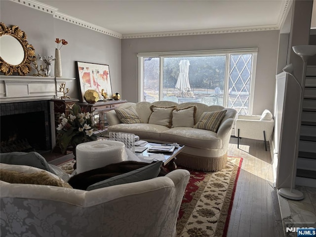 living area featuring hardwood / wood-style floors and a fireplace