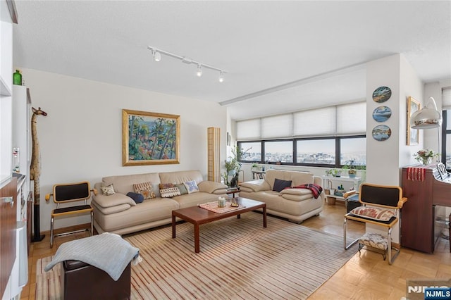 living area featuring a textured ceiling