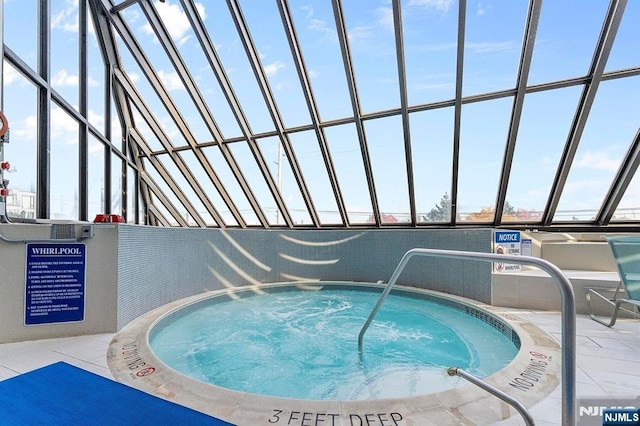 view of swimming pool featuring an indoor in ground hot tub