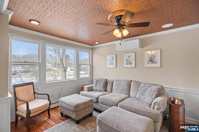 living area featuring a wainscoted wall, an ornate ceiling, ornamental molding, and an AC wall unit