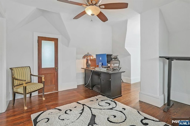 office space with lofted ceiling, a ceiling fan, baseboards, and wood finished floors