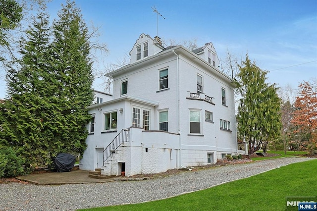 view of home's exterior featuring a lawn