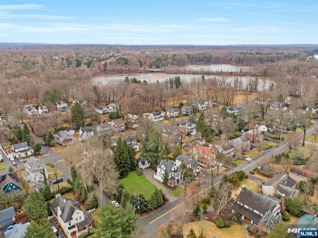 drone / aerial view with a water view and a residential view