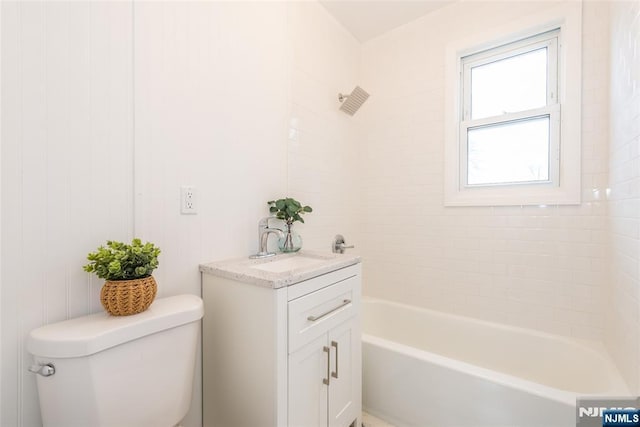 full bath with shower / bathing tub combination, vanity, and toilet