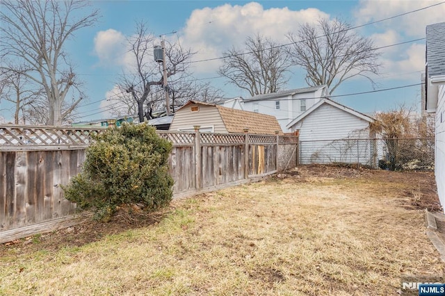 view of yard with a fenced backyard