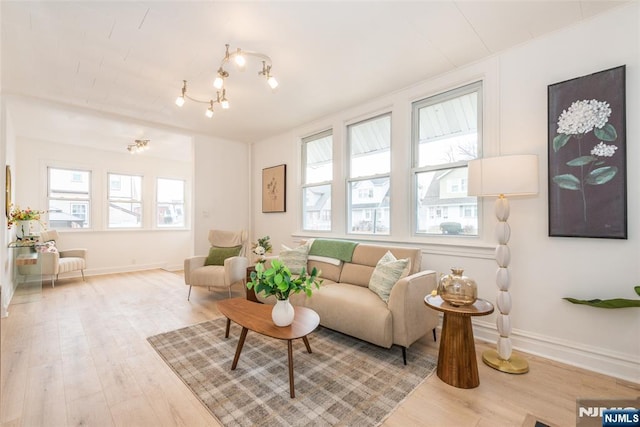 interior space with wood finished floors and baseboards