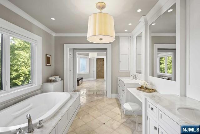 full bathroom featuring double vanity, ornamental molding, a garden tub, and a wealth of natural light