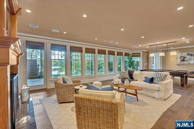 living room with pool table, recessed lighting, visible vents, and crown molding