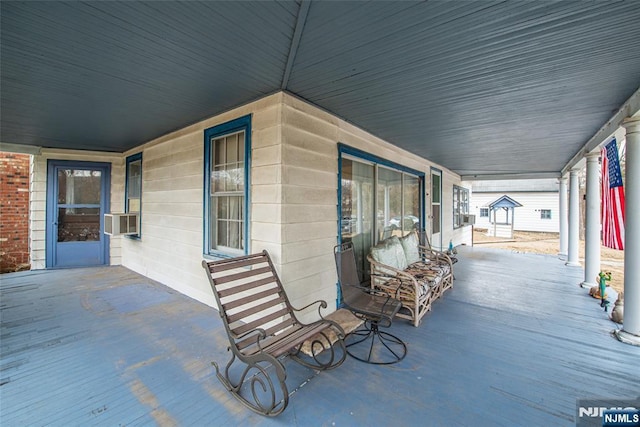 view of patio / terrace featuring covered porch and cooling unit