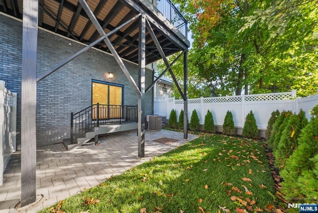 view of patio / terrace featuring fence private yard and cooling unit