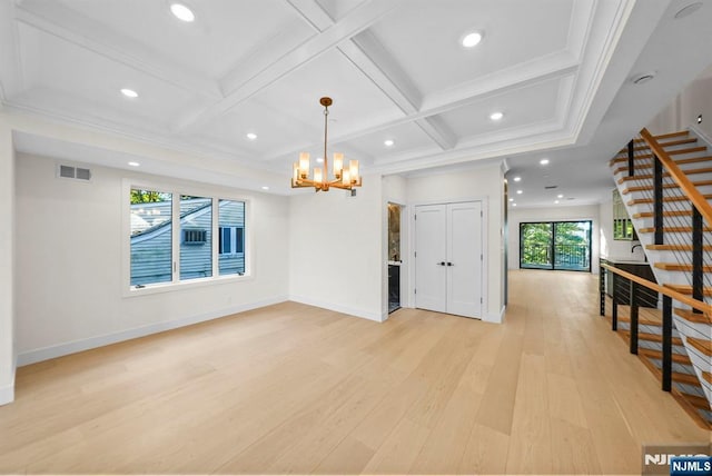 interior space featuring a notable chandelier, recessed lighting, coffered ceiling, light wood-style floors, and stairway