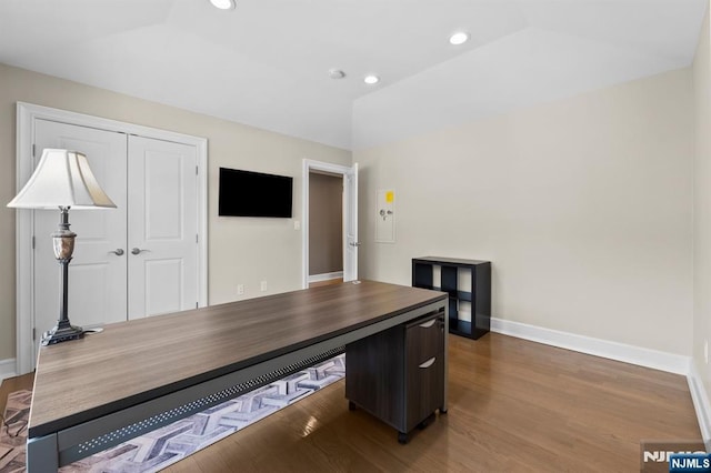 home office featuring baseboards, wood finished floors, and recessed lighting