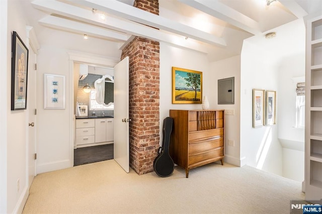 interior space featuring carpet, beam ceiling, electric panel, and baseboards