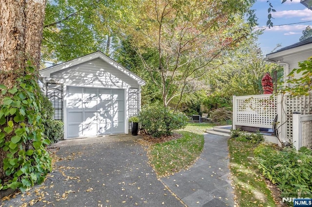 detached garage with aphalt driveway