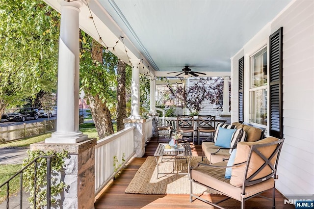 deck with covered porch, an outdoor hangout area, and a ceiling fan