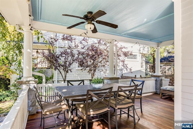 exterior space with outdoor dining area and a ceiling fan