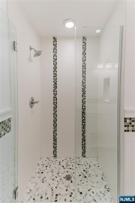 bathroom with a shower stall