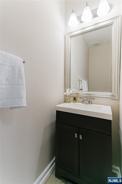 bathroom featuring vanity and baseboards