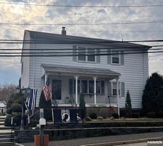 77 Shepherds Ln, Totowa, NJ 07512 - view of front of property featuring covered porch