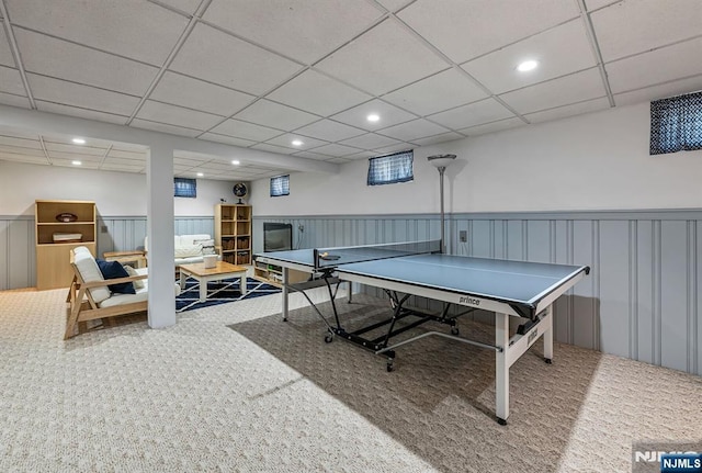 recreation room featuring carpet, a paneled ceiling, recessed lighting, and wainscoting