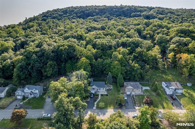 aerial view with a residential view and a wooded view