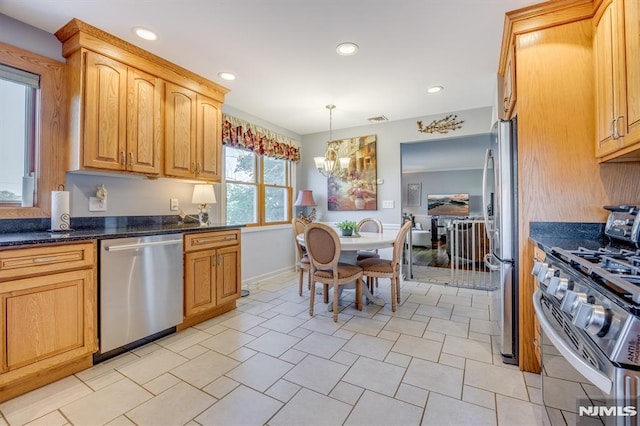 kitchen featuring visible vents, an inviting chandelier, stainless steel appliances, pendant lighting, and recessed lighting