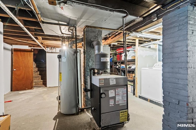 utilities featuring washer / clothes dryer, gas water heater, and a heating unit