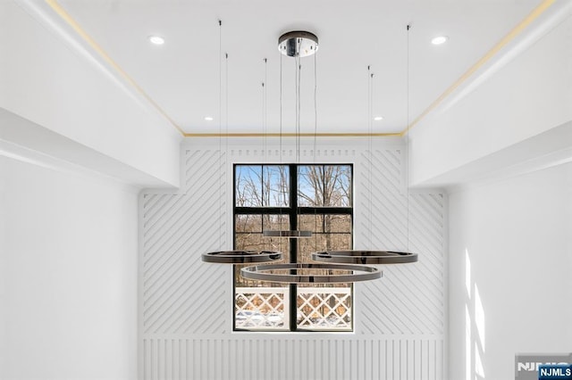 room details featuring ornamental molding and recessed lighting