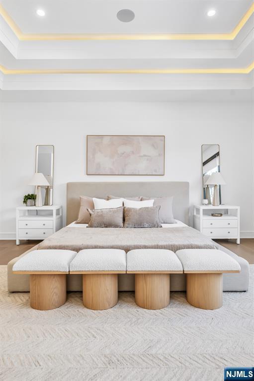 bedroom featuring baseboards, ornamental molding, wood finished floors, and recessed lighting