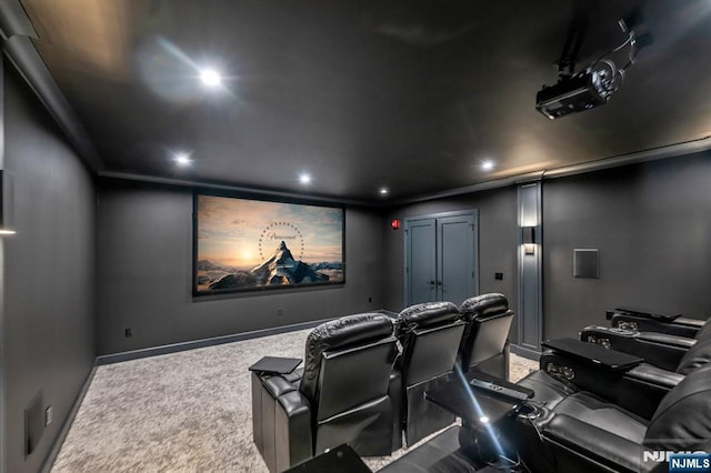 carpeted home theater with baseboards, crown molding, and recessed lighting