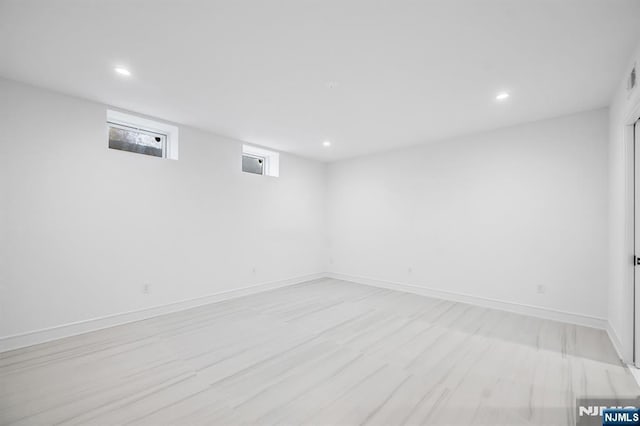 basement with recessed lighting and baseboards