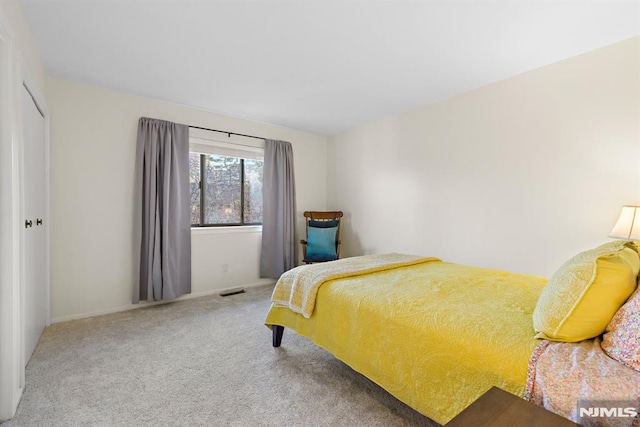 carpeted bedroom with visible vents