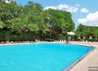 pool featuring a patio area