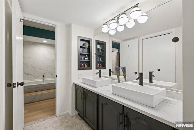 bathroom with double vanity and a sink