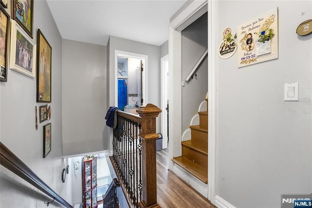 staircase with wood finished floors