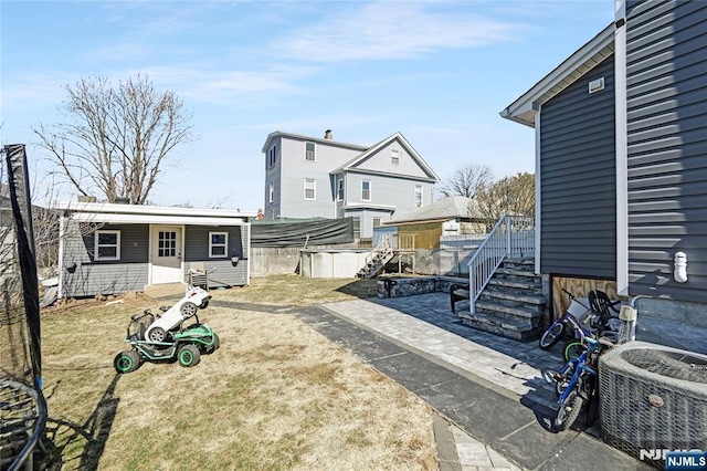 view of yard featuring central AC unit