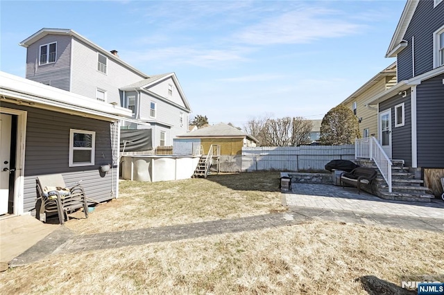 view of yard featuring a fenced in pool and fence