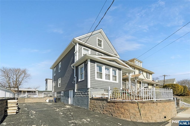 view of front of property featuring fence