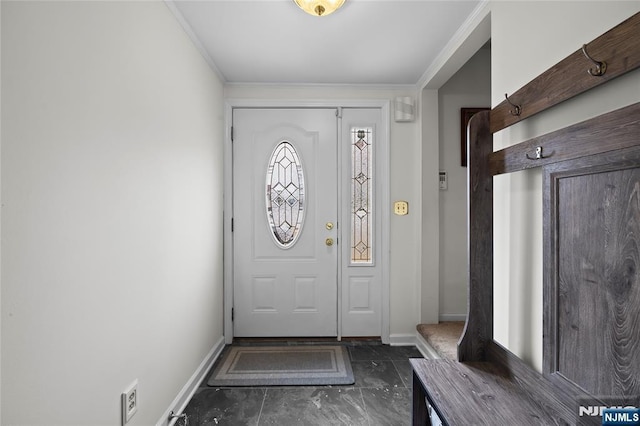 interior space featuring crown molding and baseboards